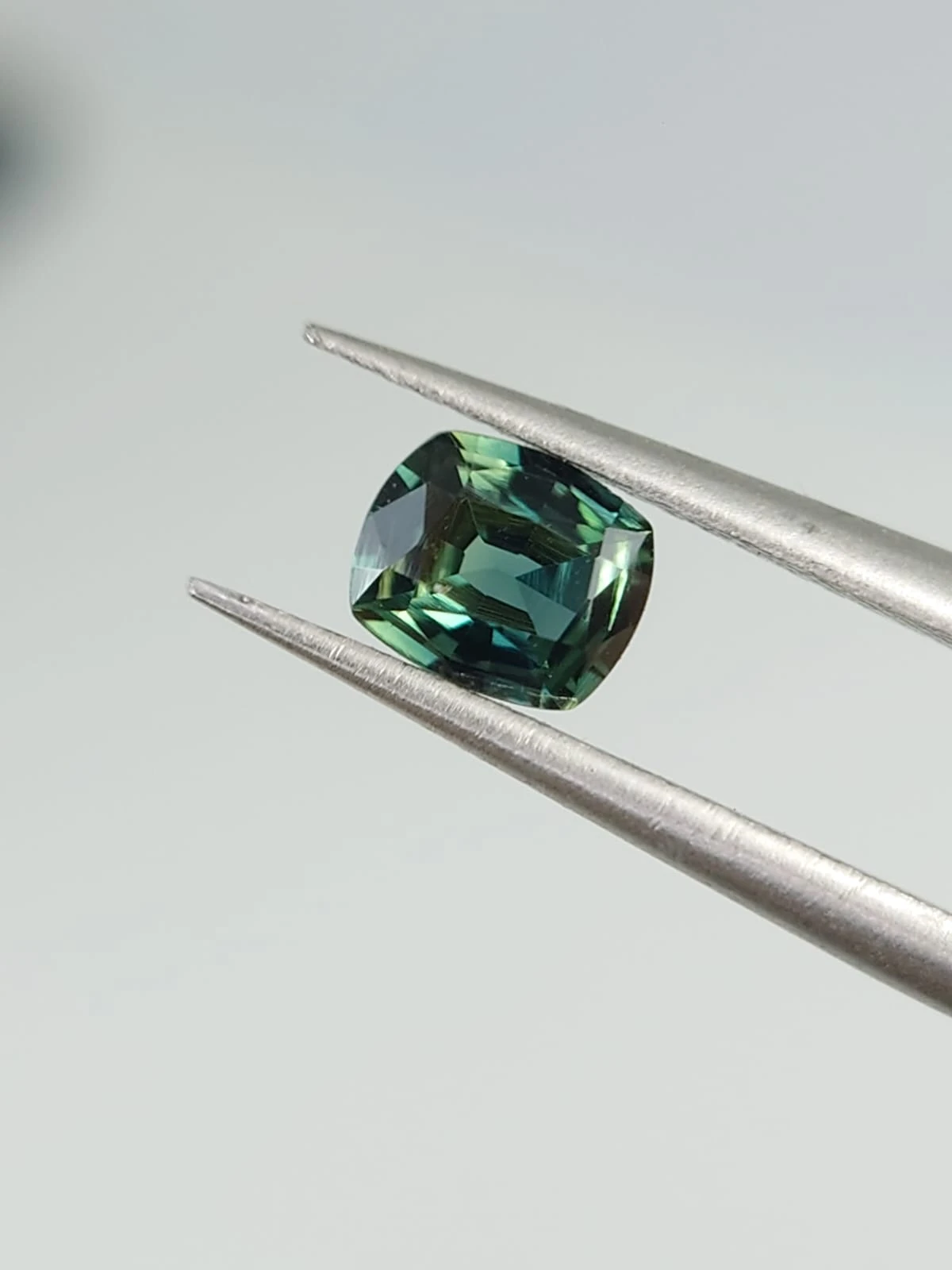 0.4ct Natural Bluish Green Sapphire from Nigeria — view 1